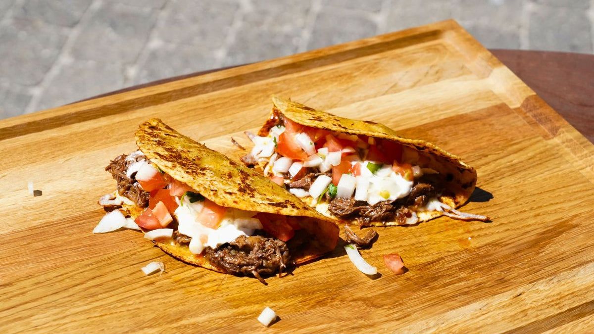 Birria Tacos with melted cheese and fresh pico de gallo