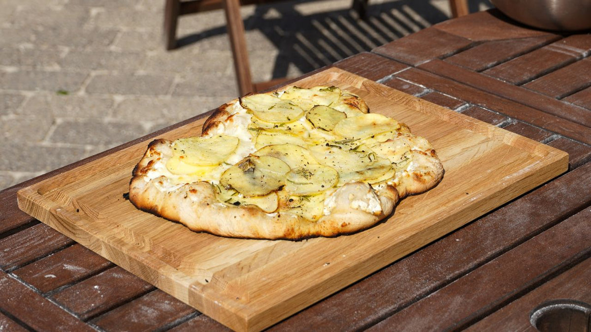 Potato pizza with crispy base and creamy topping