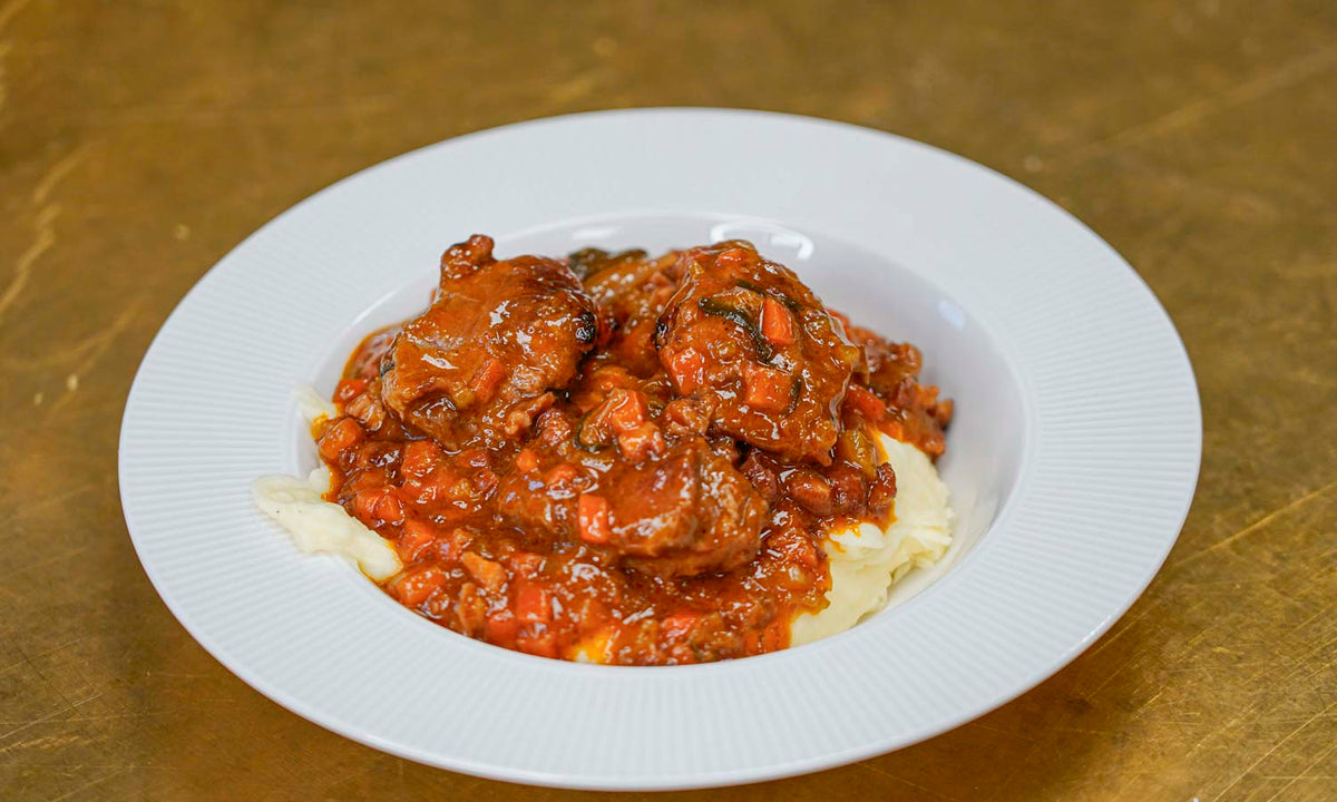 Red wine braised pork jowls with creamy mashed potatoes