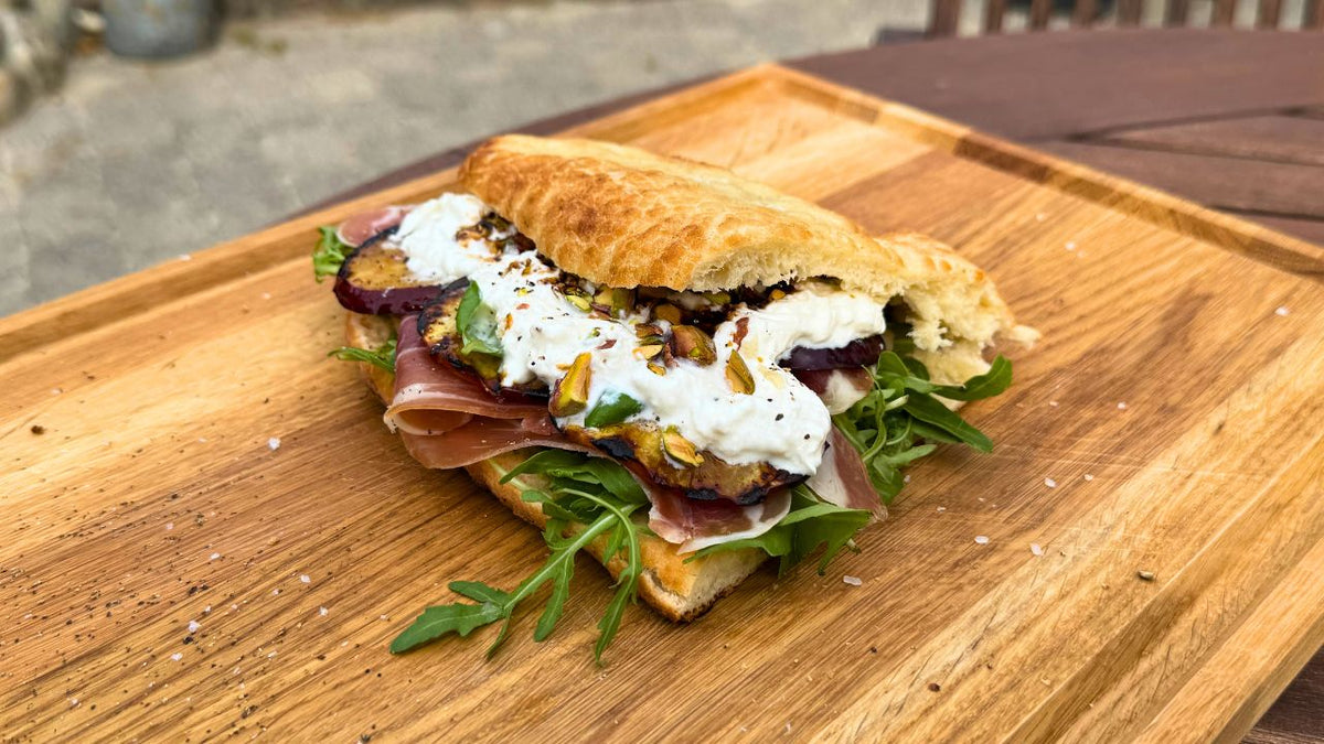 Focaccia with grilled nectarines, serrano, burrata and pistachio nuts